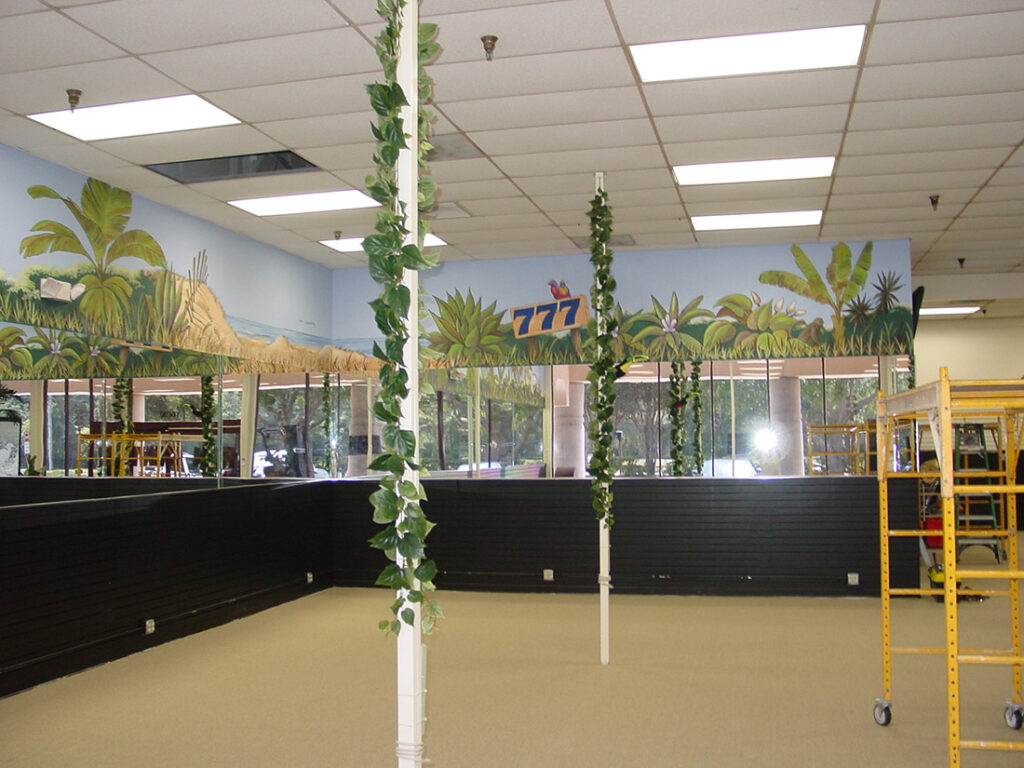 Photo of a tropically inspired mural, painted in a cartoon style, in a gaming establishment in Sarasota, FL