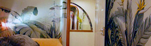 A detail photo of one of two murals that I painted inside of a yacht owned and designed by Pierro Rivolta. This one is in the master stateroom and is tropical foliage.