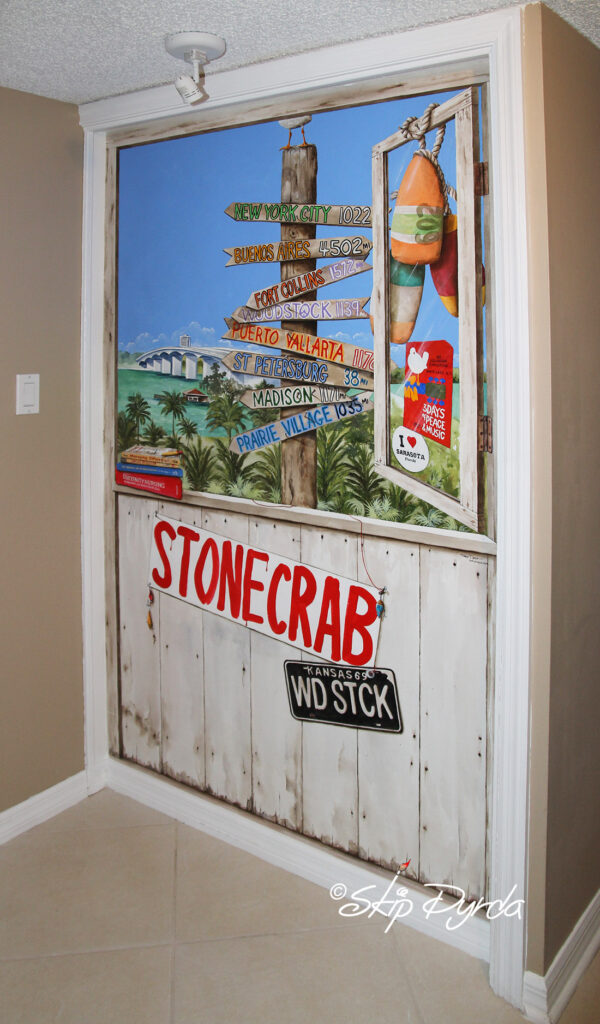 Photo of a smaller mural I painted for a condo in Sarasota, FL that shows an open window overlooking the bay.