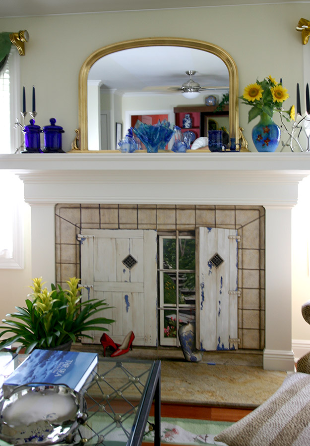 An in situ photo of a trompe l'oeil fireplace screen that I painted