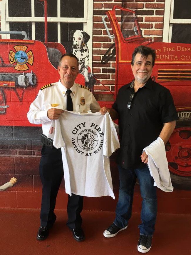 Fire chief presenting me with my custom T-shirt