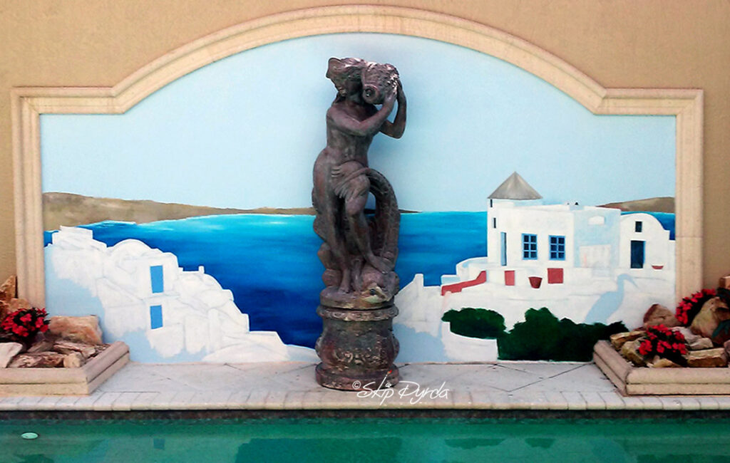Detail photo of a pool-side mural in Sarasota, FL. Painted by Skip Dyrda to look similar to Santorini, Greece