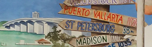 A detail photo of a small mural, painted by Skip Dyrda, of the inside door of an old fishing shack with the top part open and overlooking Sarasota Bay