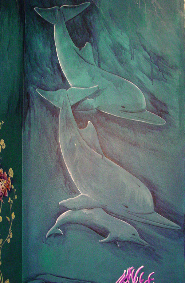Photo of an underwater scene mural I painted on 3 walls inside of the pool powder room in DIck Vitales house.