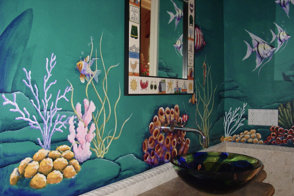 Photo of an underwater scene mural I painted on 3 walls inside of the pool powder room in DIck Vitales house.