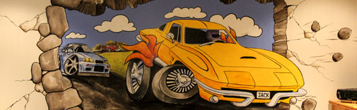 A detail photo of a mural of a yellow Corvette, painted in a young boys bedroom by Skip Dyrda
