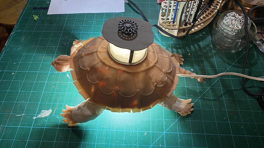 A photo of a table lamp that looks like a steampunk inspired turtle