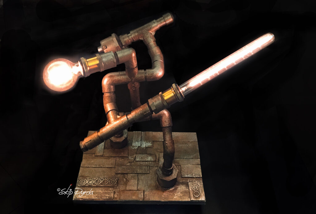 Custom made tablelamp, made to look like a fighting robot made of waterpipe