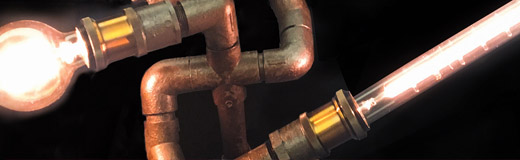 Custom made tablelamp, made to look like a fighting robot made of waterpipe