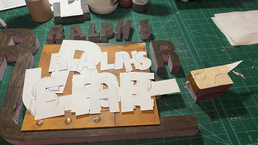 An in progress photo of a custom three dimensional sign I made for someone's repair business