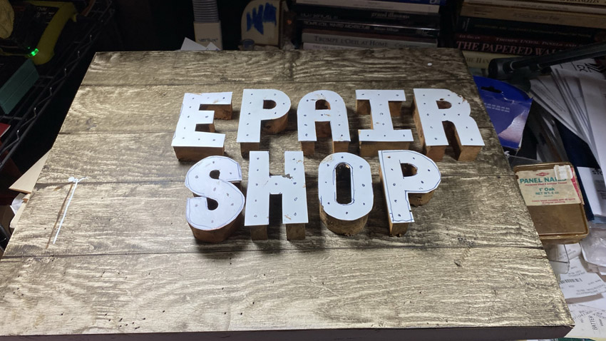 An in progress photo of a custom three dimensional sign I made for someone's repair business