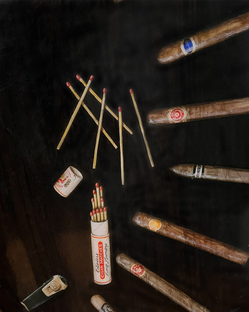 A photo of a large round coffee table that I stained and then painted over 20 Trompe L'oeil cigars on it.